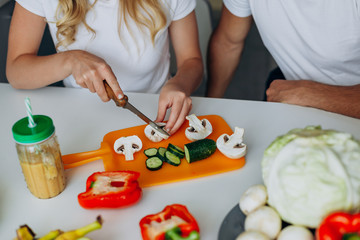 closeup female hands cutting a mushrooms. Concept healthy food.- Image