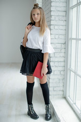 School fashion. Teen girl fashionable in school uniform. 
