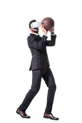 Fototapeta premium businessman in formal wear and Virtual reality headset holding basketball Isolated On White