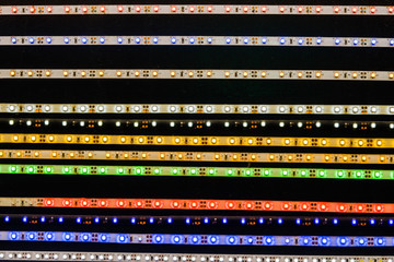 The market for electrical materials. Sale tapes with LED bulbs. Abstract background with LED...