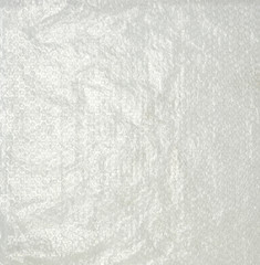 transparent packaging film with air bubbles for packaging of packages in transit