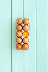 Farm products design for blog with eggs on mint green wooden background top view space for text