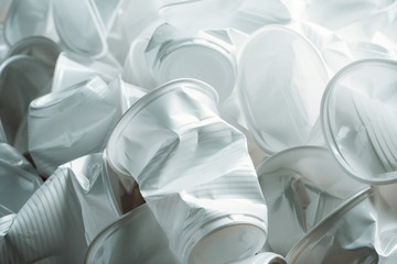 Pile of crumpled white disposable plastic cups. Zero waste concept, plastic free