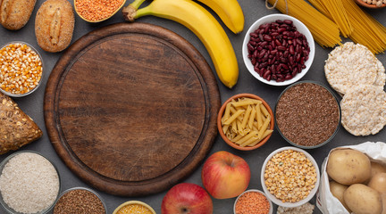 Gluten free food with grains and fruits around copy space