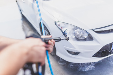 Self car washing by using high pressure water.