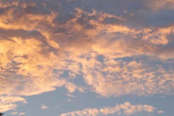 Fototapeta na wymiar sky with clouds orange glow under clouds