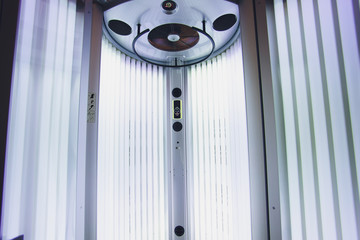 Vertical Tanning turbo Solarium Light Machine with glowing blue light ultraviolet lamps for tanning...