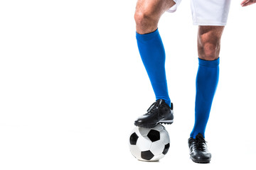 Cropped view of soccer player standing on ball Isolated On White