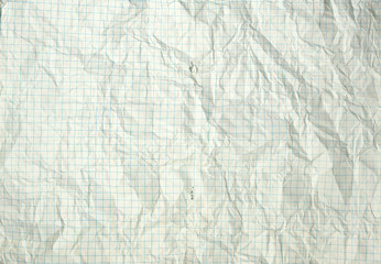 torn and wrinkled white blank squared sheet from a school notebook, back to school