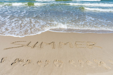 Baltic Sea. The inscription on the sand 