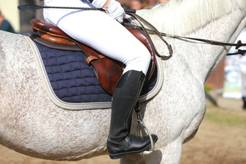 Closeup of a leather saddle for equestrian sport on horseback