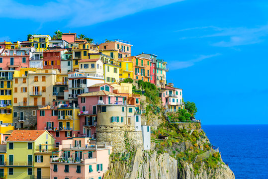 Colorful houses in Manarola Village in Cinque Terre National Park. Beautiful scenery at coast of Italy. Fisherman village in the province of La Spezia, Liguria, Italy