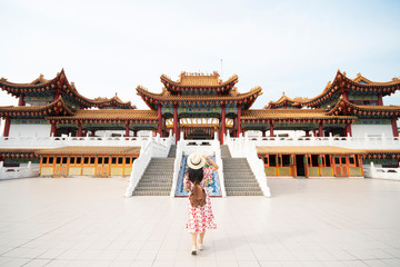 Woman tourist is sightseeing and traveling inside Thean Hou Temple in Kuala Lumpur, Malaysia.