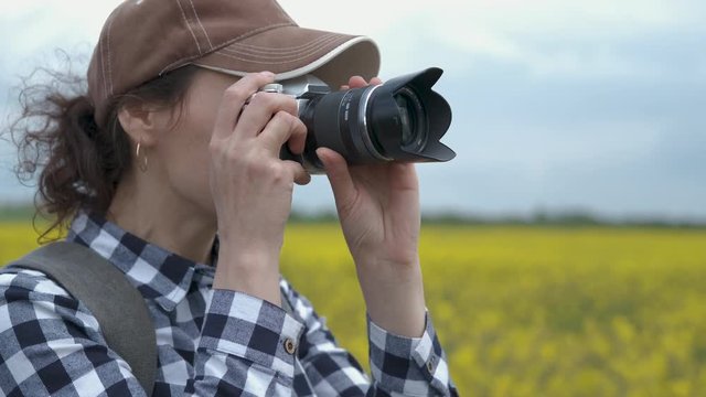 Woman photographer in the countryside.