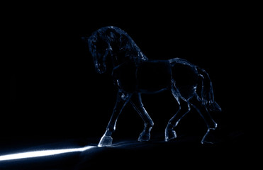 The crystal horse in the moonlight on black background