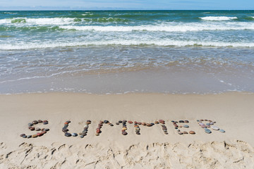 Baltic Sea. The inscription on the sand 
