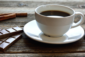 cup of black coffee on rustic wooden table