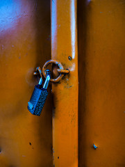 Old lock on the brown door