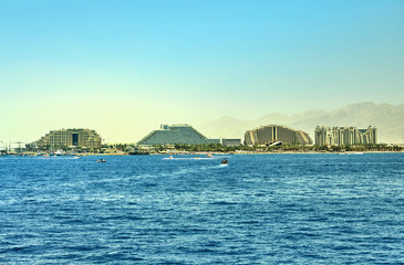 View from the luxury yacht to the Red Sea. Hotels for tourists, boats and yachts for a holiday.