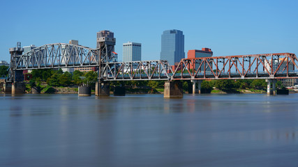 Little Rock, capital of Arkansas, USA. Skyline with Arkansas River at daytime in summer, long exposure. 