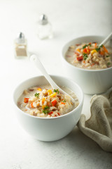 Homemade chowder soup in white bowls