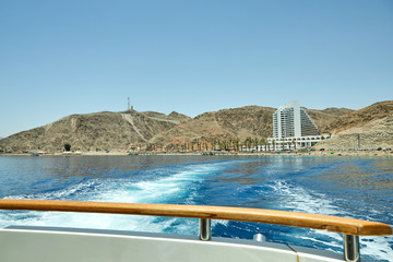 View from the luxury yacht to the Red Sea. Hotels for tourists, boats and yachts for a holiday.