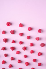 Raspberry sweet organic juicy berries, pattern, texture, on pink paper background, flat lay