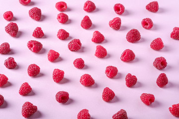 Raspberry sweet organic juicy berries, pattern, texture, on pink paper background