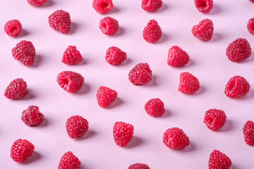 Raspberry sweet organic juicy berries, pattern, texture, on pink paper background