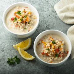 Homemade chowder soup in white bowls