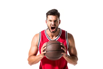 Zelfklevend Fotobehang angry basketball player with ball Isolated On White © LIGHTFIELD STUDIOS