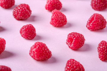 Raspberry sweet organic juicy berries, pattern, texture, on pink paper background