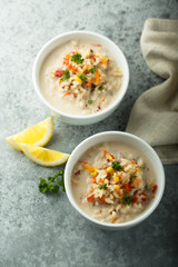 Homemade chowder soup in white bowls