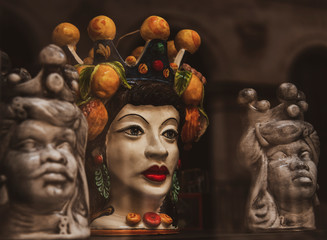 Traditional painted sicilian statues ceramic heads with crown in Ortigia (Ortygia) island in...