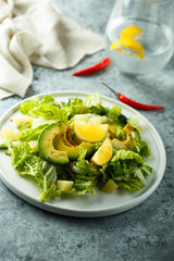 Healthy avocado salad with lemon dressing