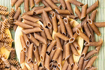 raw penne pasta close up
