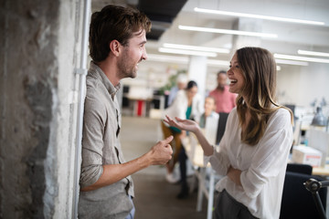 Group of business people working and communicating in office together with colleagues
