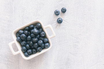Fresh raw blueberries. Overhead, top view or above view composition with copy space