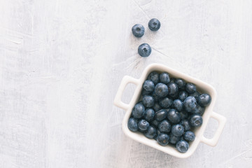 Fresh raw blueberries. Overhead, top view or above view composition with copy space