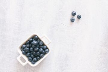 Fresh raw blueberries. Overhead, top view or above view composition with copy space