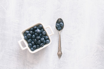 Fresh raw blueberries. Overhead, top view or above view composition with copy space