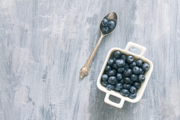 Fresh raw blueberries. Overhead, top view or above view composition with copy space