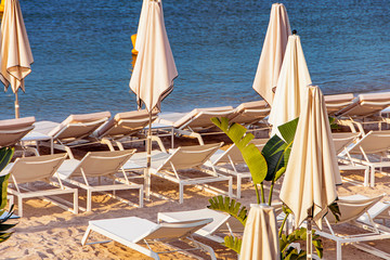 Sea bay with yachts boats and beach umbrella in Cannes