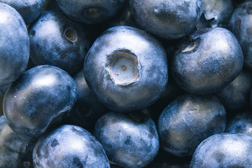 Close up of fresh raw blueberries. Overhead, top view or above view composition