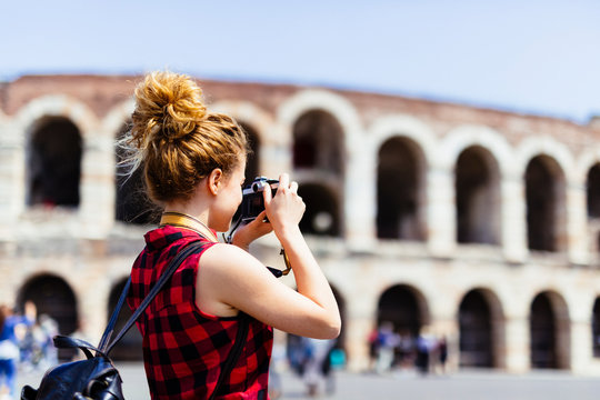 Italy, Verona, woman taking picture of Verona Arena