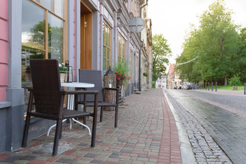 Fototapeta na wymiar Cozy outdoor cafe in Latvia. Street view, outdoor summer restaurant