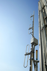 Industrial antenna at the building rooftop.