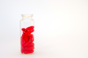 Medicine red pills or capsules on white background with copy space. Drug prescription for treatment medication.  Pharmaceutical medicament.