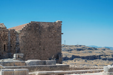 Remains of the ancient temple and medieval wall in Lindos (Rhodes, Greece)