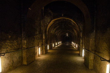 Dark spooky underground alley of european vintage building